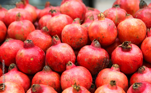 Pomegranate fruits in heap at market