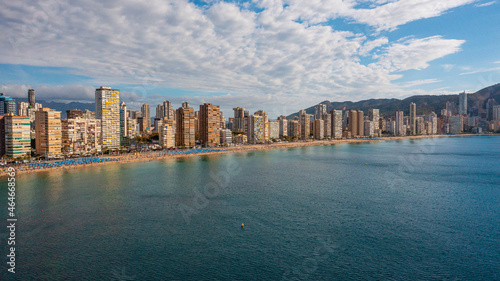 Benidorm,Alicante,Spain.Aerial photo from drone to Benidorm city skyline with beach and mountains in the background.These are the most beautiful views from the drone to the skyscrapers of Benidorm © Sandis