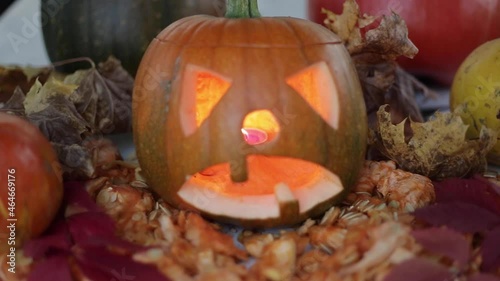 pumpkins and autumn leaves autumn jack-o-lantern in the atmosphere of halloween