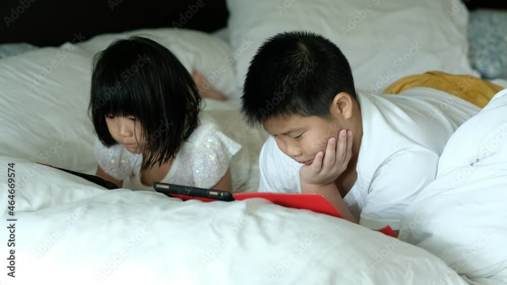 two children addicted tablet, asian kid watching cartoon
two children addicted tablet, asian kid watching cartoon