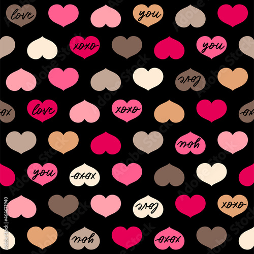 Seamless pattern of hearts and words on black background for valentine’s day.
