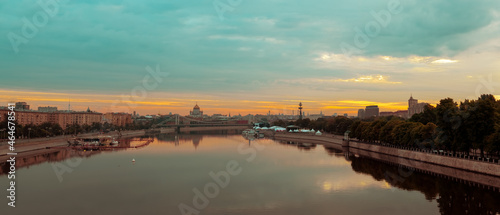 Sunrise over Moscow City and Moscow river. Early morning cityscape panorama with Cathedral of Christ the Saviour and Peter the Great Statue on the horizon. city landscape view from Andreyevsky bridge