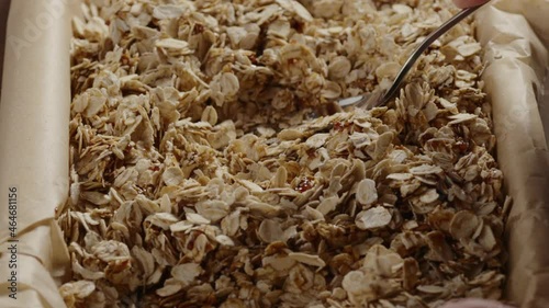 Slow motion making homemade granola tamp