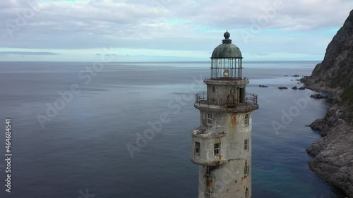 Flying Around a Tower of Lighthouse Aniva on the Rock in Sakhalin Island, Russia.