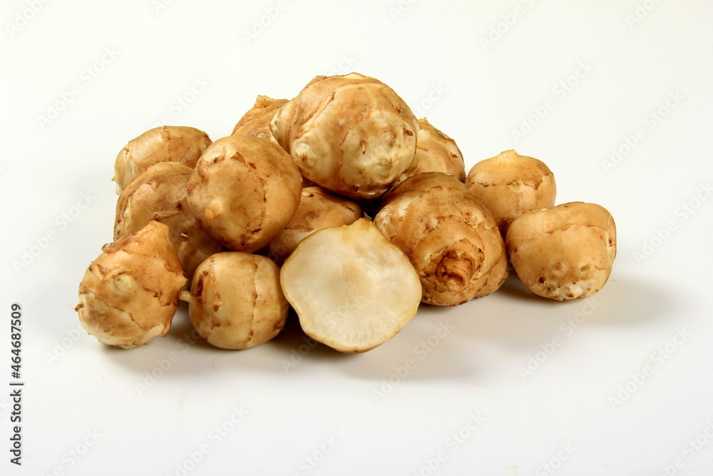 Jerusalem artichoke with white background, close up. Freshly harvested Jerusalem artichoke or topinambur Jerusalem artichoke with white background, close up. Freshly harvested Jerusalem artichoke or topinambur