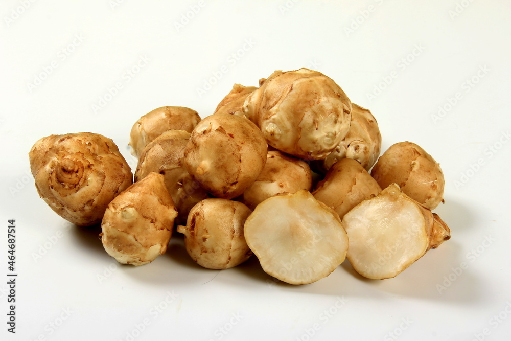 Jerusalem artichoke with white background, close up. Freshly harvested Jerusalem artichoke or topinambur Jerusalem artichoke with white background, close up. Freshly harvested Jerusalem artichoke or topinambur