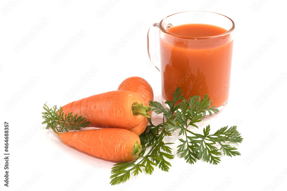 On an isolated white background a glass with carrot saturated healthy juice and fresh carrots. On an isolated white background a glass with carrot saturated healthy juice and fresh carrots.