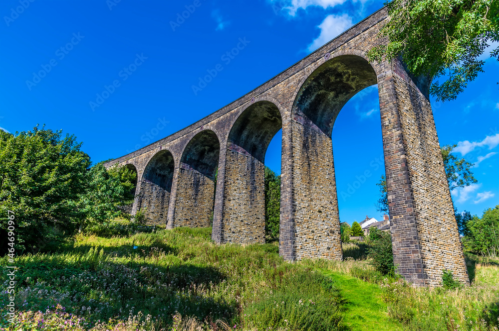 A view looking up towards the Thornton viaduct next to the town of Thornton, Yorkshire, UK in summertime