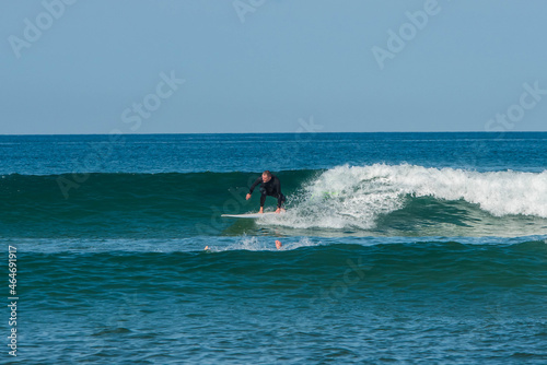 senior surfer in action in the waves