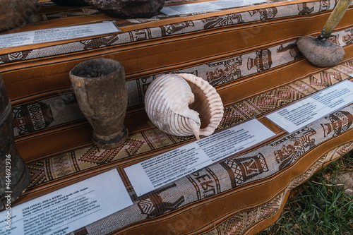 ceramics in the incas on a traditional table with traditional blanket queros plates, glasses and cultural basijas from the Andes of Peru photo