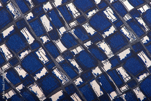 Texture background pattern. Silk fabric with a pattern of blue ,white and black squares ,100% polyester pattern