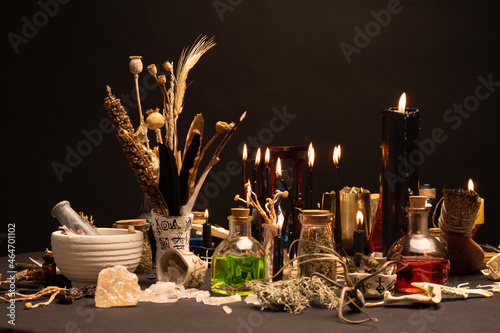 Fotografi Witchcraft still life with black burning candles selective focus