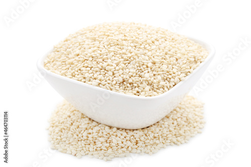 Sesame seeds in bowl isolated on white background