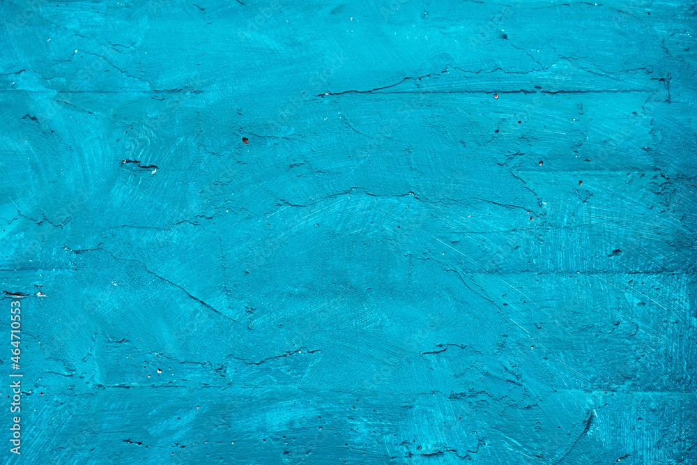Textured wall in bright turquoise pastel color