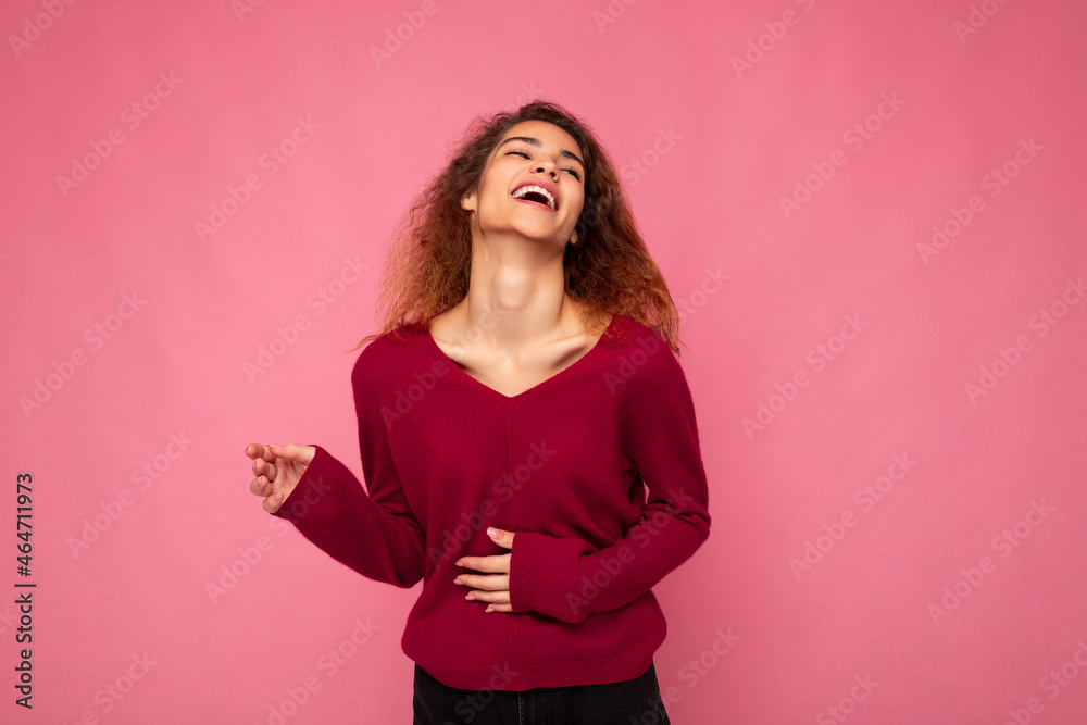 Photo of young happy positive pretty nice brunette wavy woman with sincere emotions wearing casual pink sweater isolated over pink background with empty space and laughing Photo of young happy positive pretty nice brunette wavy woman with sincere emotions wearing casual pink sweater isolated over pink background with empty space and laughing
