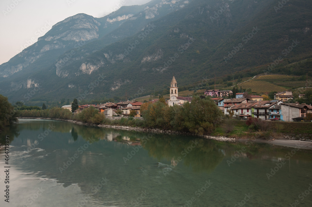 hamlet on the Adige river in autumn.
