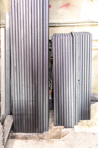 Square pipes are cut into short pieces and stacked neatly in a locksmith's shop.