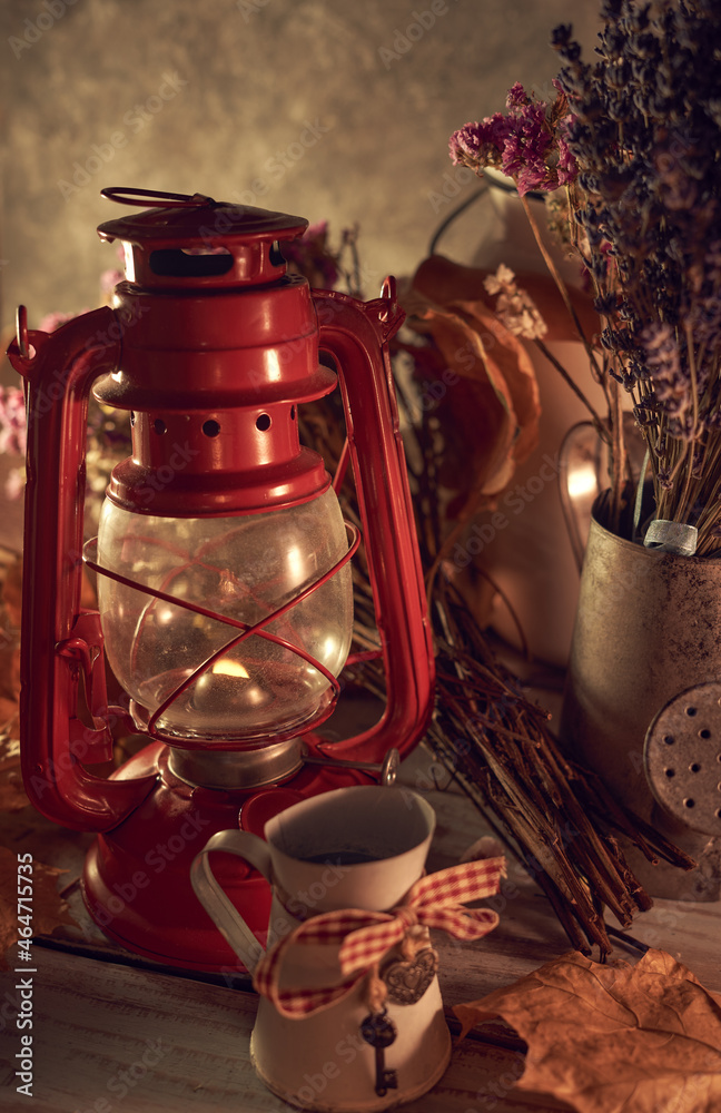 Vintage still life with an old kerosene lamp on a rustic background