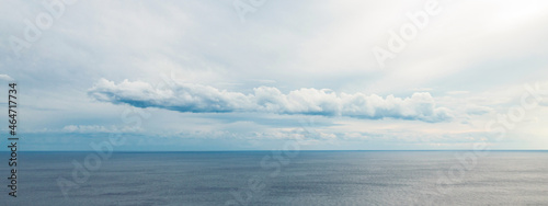 Dramatic seascape view with cloudy sky.
