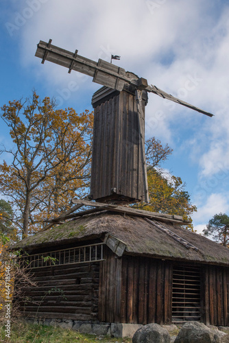 Old mill from 1750s replaced 1900 in a park in Stockholm, a colorful autumn day photo