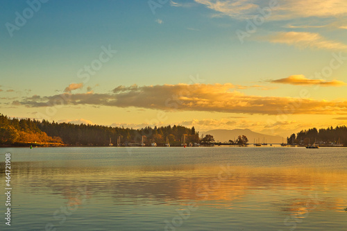 A view of a sunrise over the ocean and over protection island and newcastle island in Nanaimo, Vancouver Island, British Colombia, Bc Canada © JoelBourgoin