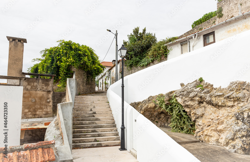 a street and a white wall in Montemor-o-Velho, district of Coimbra, Beira Litoral province, Portugal