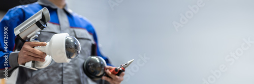 Tablou pe pânză Technician Using Surveillance Security Camera Video