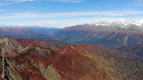 Aerial shot of mountains. Mountains, peaks, cliffs, rocks, ridges, landscape, green grass, sky, clouds, nature, uncultivated nature, drone video. 4k