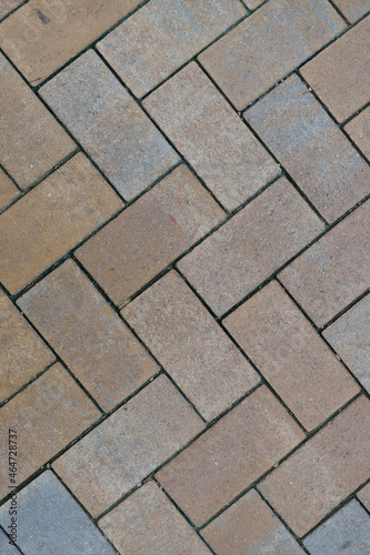 vertical color photo of a stone floor with interesting pattern as background photo