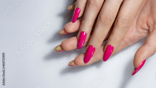 Female hands with pink nail design. Pink nail polish manicured hands.