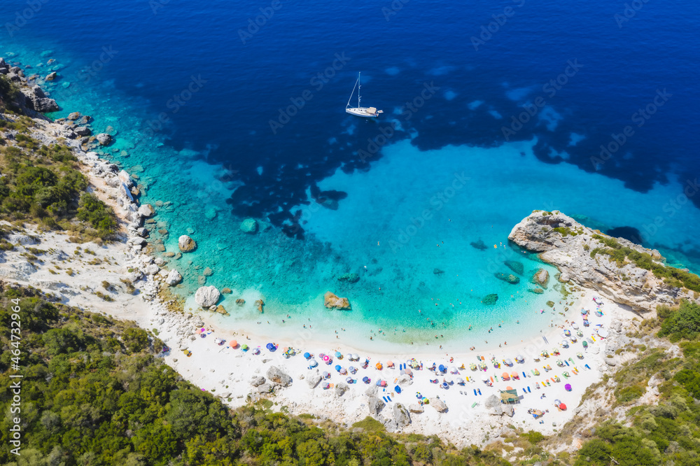 Aerial drone photo of iconic paradise sandy beach of Agiofili near port of Vasiliki with emerald crystal clear sea and sail boats docked, Lefkada island, Ionian, Greece