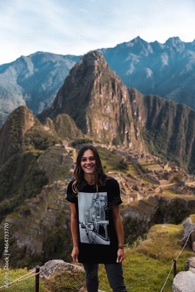 Young female tourist with Llama t shirt at Machu Picchu in Peru