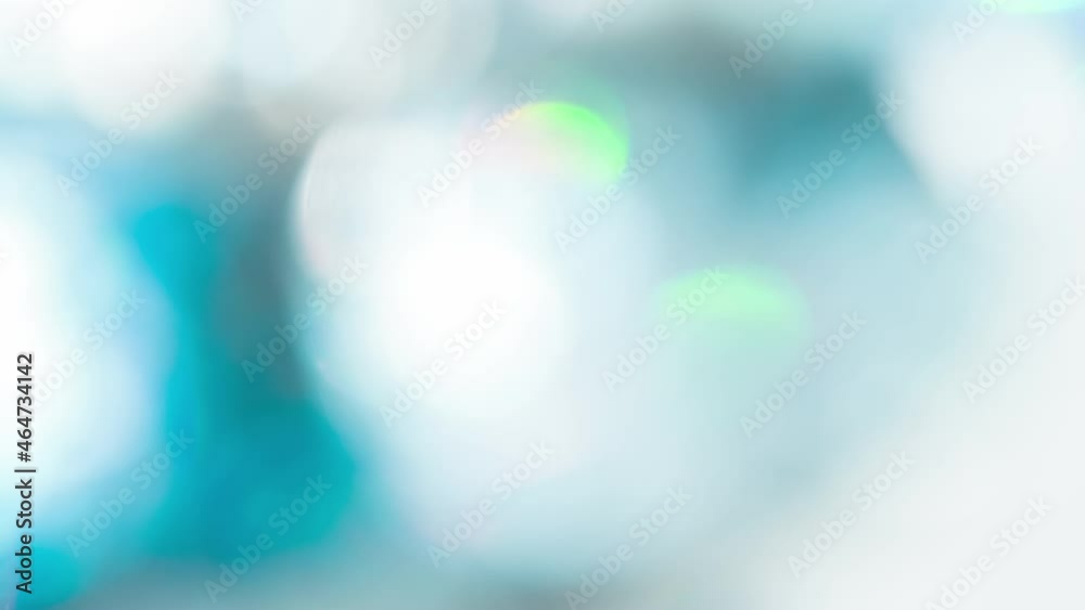 Slow Whirling Sparkling Bbokeh. Loop. A large number of small sparkling faceted crystals shimmer with all the colors of the rainbow