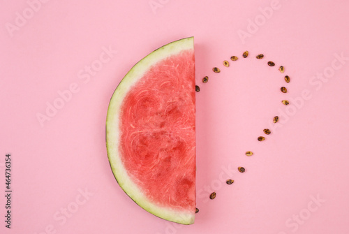Watermelon slice with heart made from seeds. Love summer concept. Space for text. Love fruits