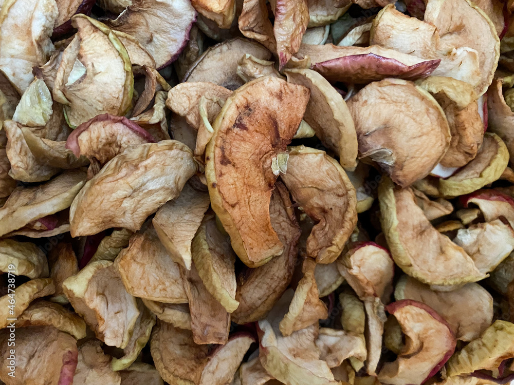Background of dried apples in close-up. Texture of dried apples