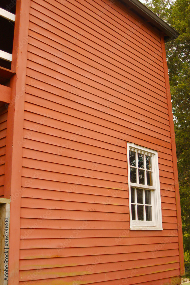 Red siding on old building