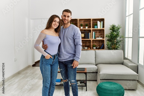 Young caucasian couple smiling happy standing at home. © Krakenimages.com