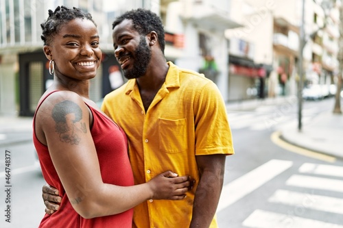 Young afircan american couple smiling happy and hugging at the city.
