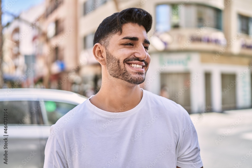 Fototapeta premium Handsome hispanic man smiling happy outdoors