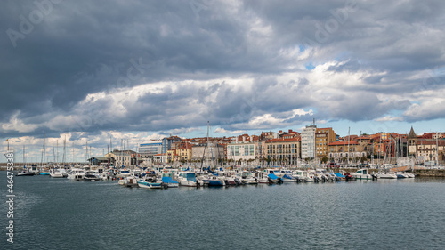 Gijon city marina with dramatic clouds, Asturias Spain.