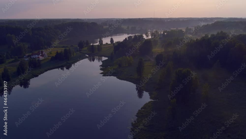 Rouge.Estonia-July 12.2021: Beautiful aerial shot of the Estonian nature and landscape. Awesome lakes and forest. Local travel. Foggy weather. Camera slowly zooming out. Geology shot. Rouge.Estonia-July 12.2021: Beautiful aerial shot of the Estonian nature and landscape. Awesome lakes and forest. Local travel. Foggy weather. Camera slowly zooming out. Geology shot.