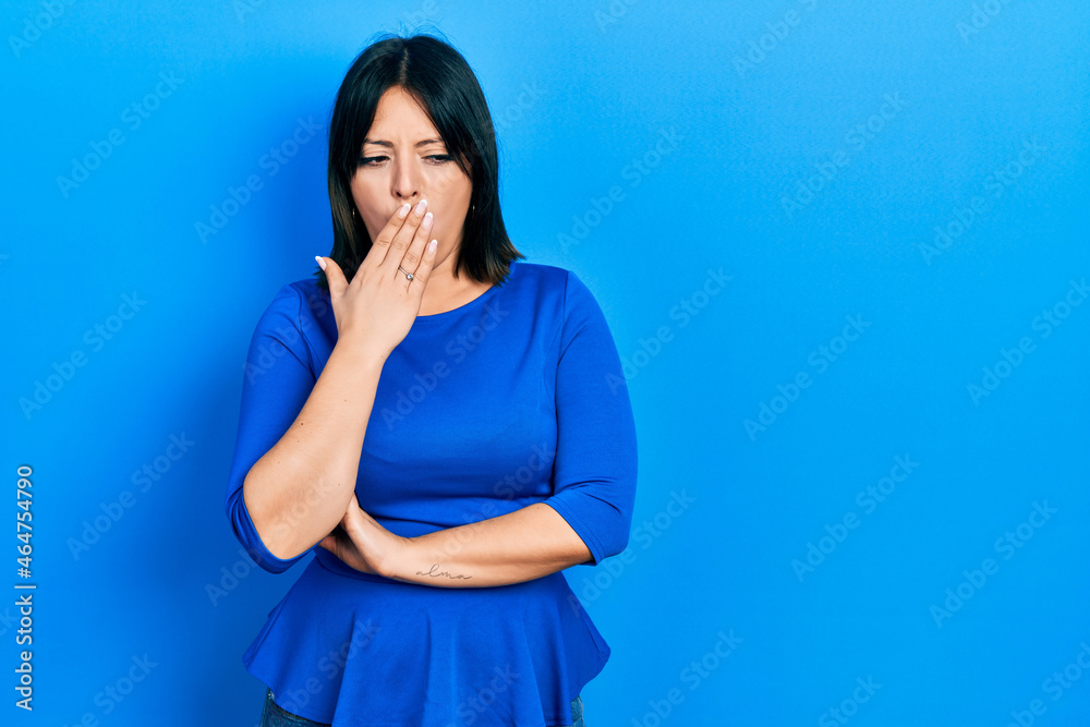 Young hispanic woman wearing casual clothes bored yawning tired covering mouth with hand. restless and sleepiness. Young hispanic woman wearing casual clothes bored yawning tired covering mouth with hand. restless and sleepiness.