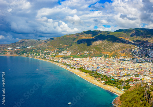 Fototapeta Naklejka Na Ścianę i Meble -  sunny view of Alanya and the port against the backdrop of mountains and clouds in autumn