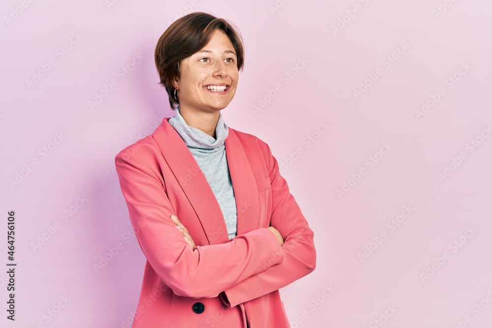 Young business woman smiling happy and confident with crossed arms standing over isolated background Young business woman smiling happy and confident with crossed arms standing over isolated background