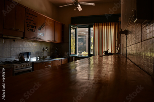 interior of a kitchen illumineted by the sun ligth photo