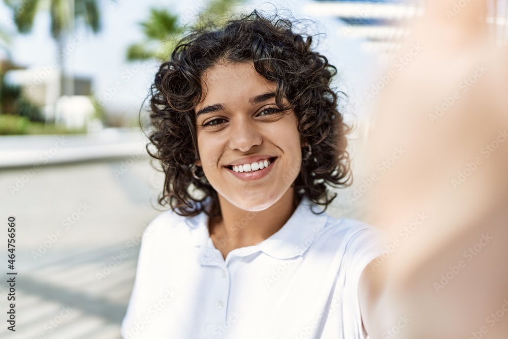 Young latin girl smiling happy standing at the city. Young latin girl smiling happy standing at the city.