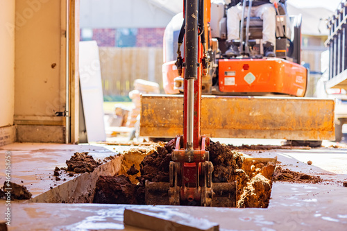 Photography Worker was working on a garage underground storm shelter installation