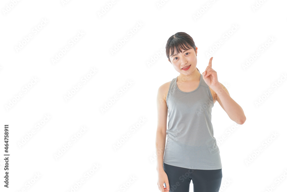 アドバイスをするスポーツウェアを着た若い女性 アドバイスをするスポーツウェアを着た若い女性