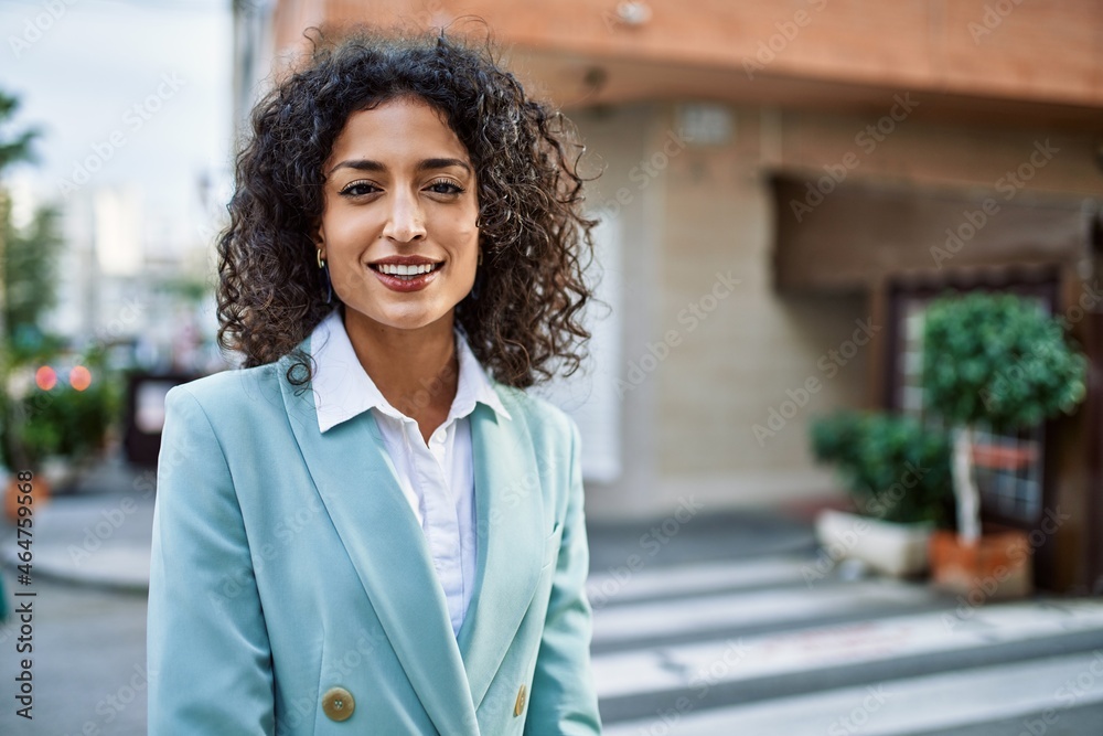 Young hispanic business woman wearing professional look smiling confident at the city Young hispanic business woman wearing professional look smiling confident at the city