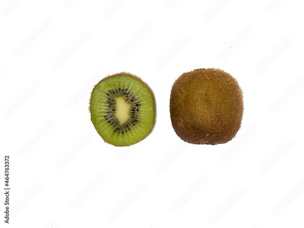 Unpeeled kiwi and half on a white background, top view. Unpeeled kiwi and half on a white background, top view.